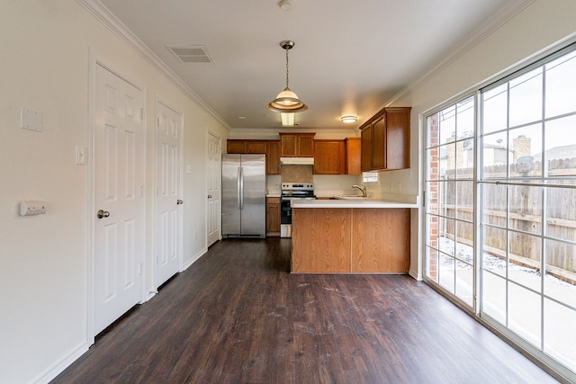 kitchen featuring stainless steel appliances, visible vents, hanging light fixtures, light countertops, and brown cabinets