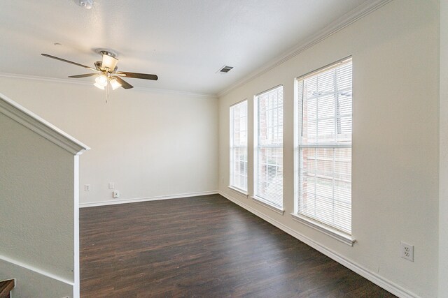 empty room featuring dark wood-type flooring and ceiling fan