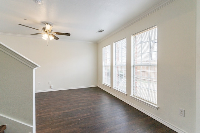 unfurnished living room with dark wood-style floors, crown molding, visible vents, a ceiling fan, and baseboards