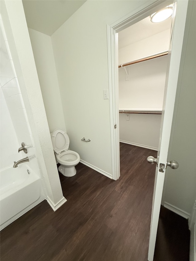 bathroom featuring hardwood / wood-style flooring and toilet