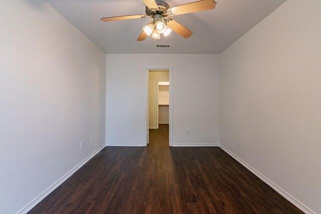 corridor featuring dark hardwood / wood-style floors