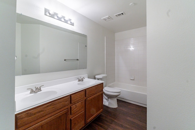 bathroom featuring wood finished floors, a sink, and visible vents