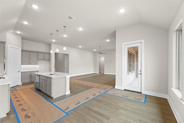 kitchen with light wood-style flooring, visible vents, a sink, and gray cabinetry