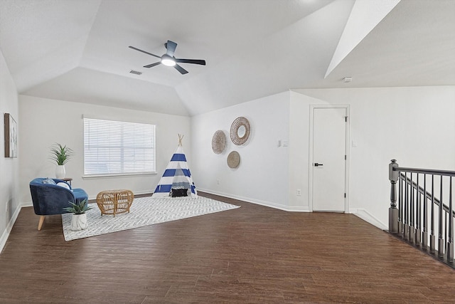 unfurnished room with lofted ceiling, dark wood-type flooring, and ceiling fan