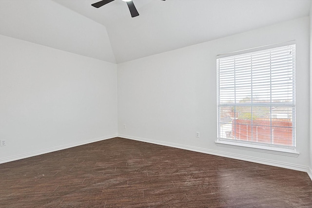 spare room with vaulted ceiling, ceiling fan, and dark hardwood / wood-style flooring