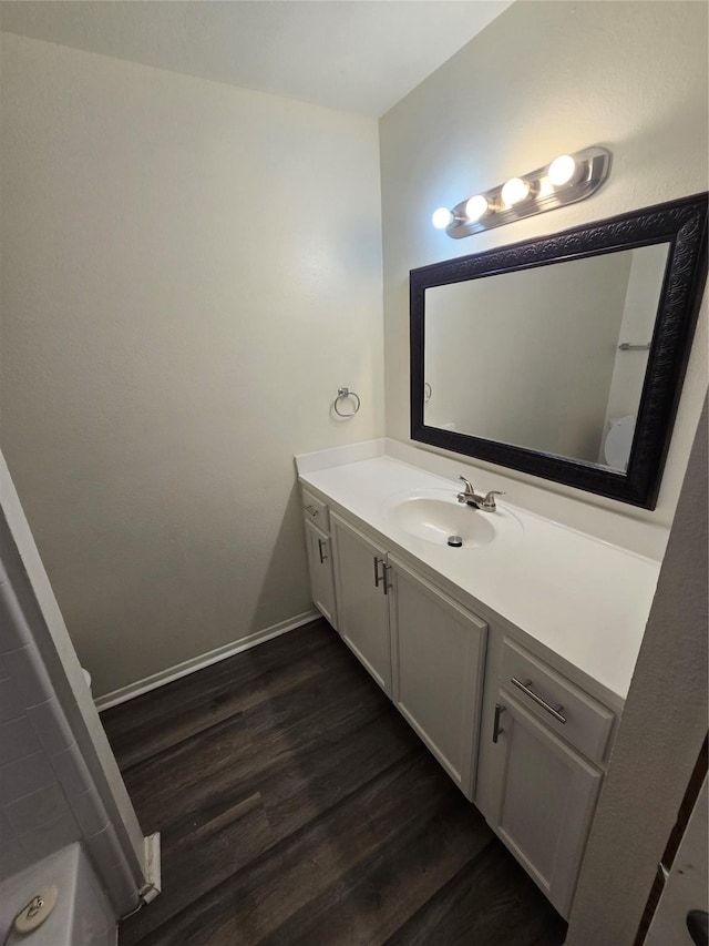 bathroom featuring hardwood / wood-style flooring and vanity