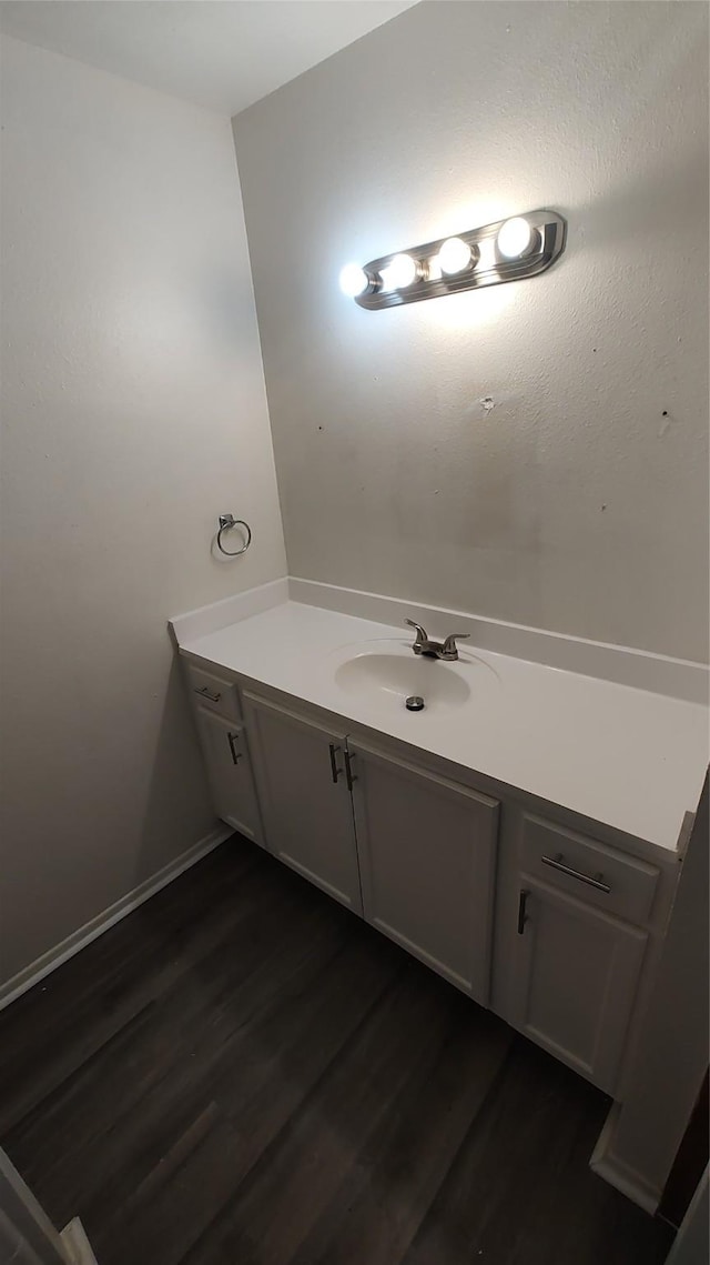 bathroom featuring vanity and hardwood / wood-style floors