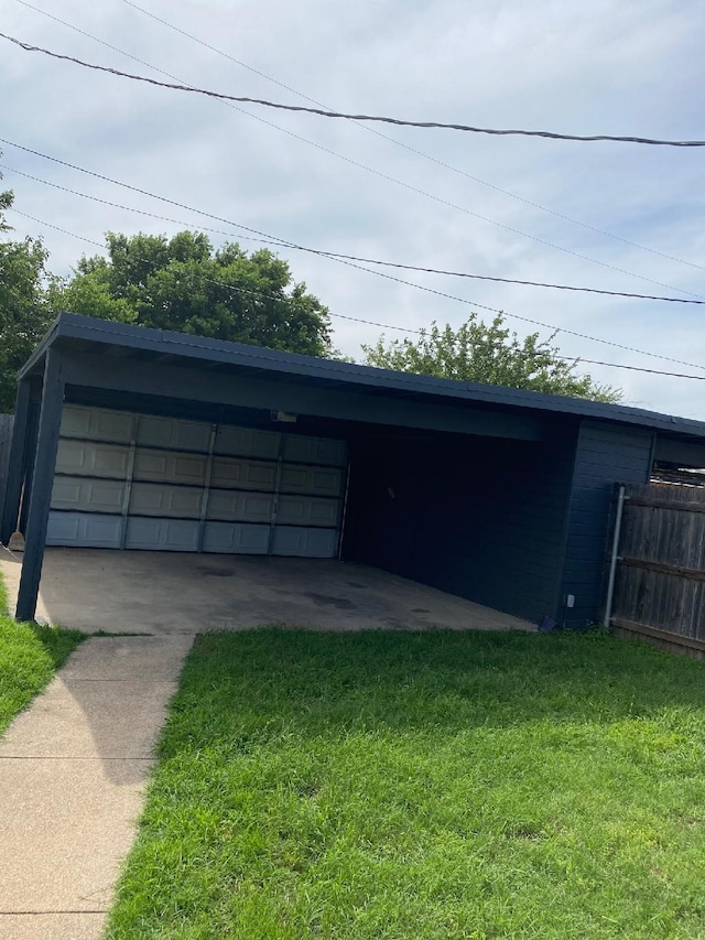 garage featuring a lawn