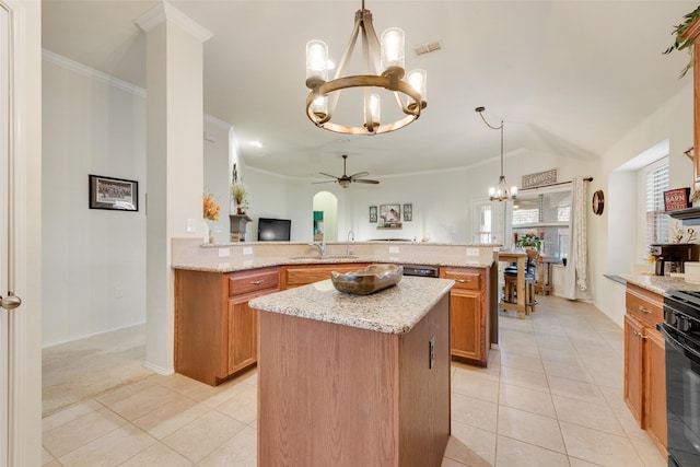 kitchen featuring light colored carpet, a kitchen island, light stone countertops, and hanging light fixtures