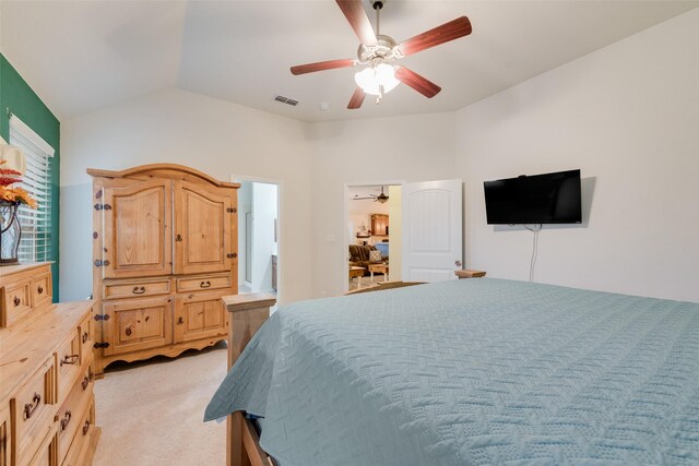 carpeted bedroom with lofted ceiling, connected bathroom, and ceiling fan