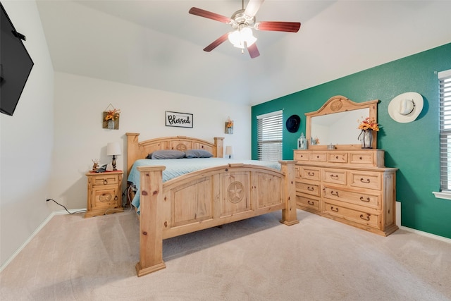 bedroom with light carpet and ceiling fan