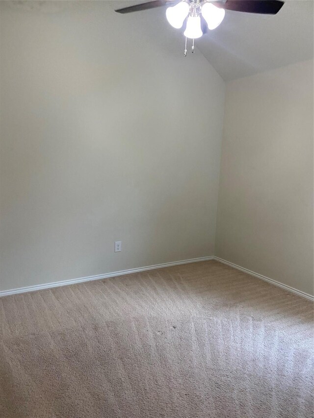 empty room with ceiling fan and carpet flooring