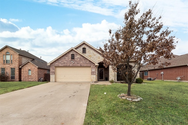 view of front of property featuring a garage, a front lawn, and central air condition unit