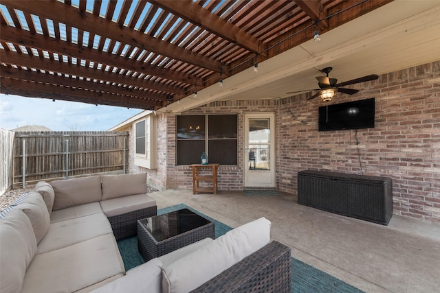 view of patio featuring outdoor lounge area, ceiling fan, and a pergola