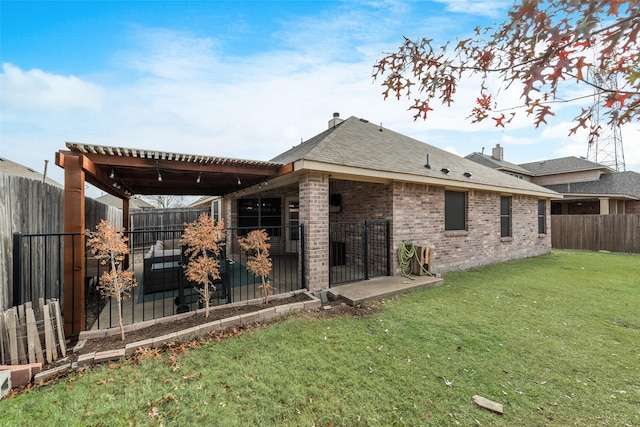 rear view of property featuring a yard