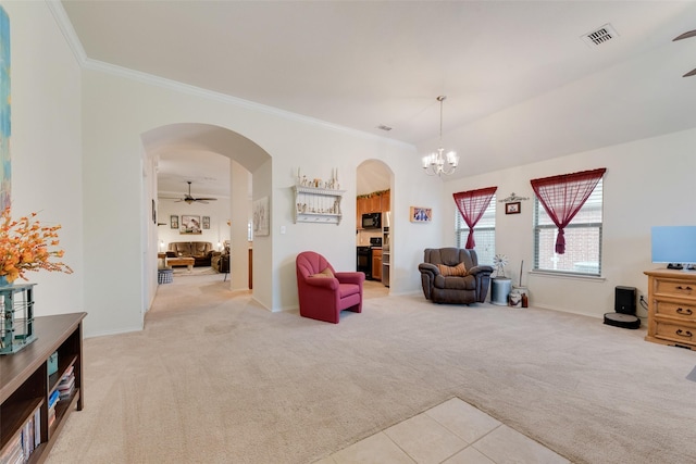 sitting room featuring ornamental molding, ceiling fan with notable chandelier, and light carpet