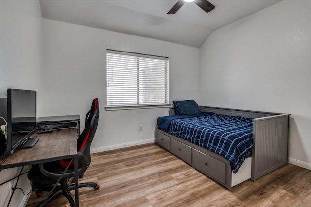 bedroom with lofted ceiling, wood-type flooring, and ceiling fan