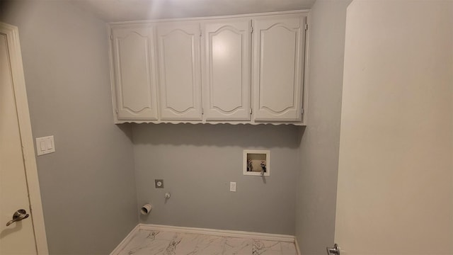 clothes washing area featuring hookup for a washing machine, hookup for an electric dryer, cabinets, and hookup for a gas dryer