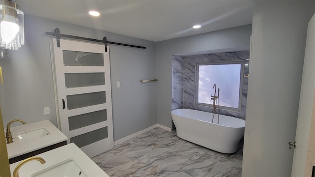 bathroom featuring vanity and a tub to relax in