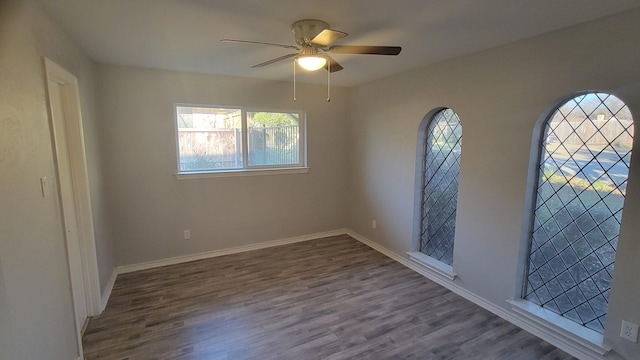 empty room featuring hardwood / wood-style flooring and ceiling fan