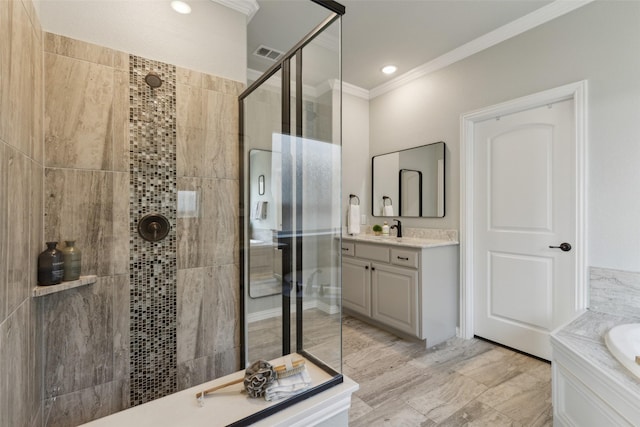 bathroom featuring vanity, ornamental molding, and independent shower and bath