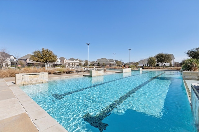 view of pool with pool water feature