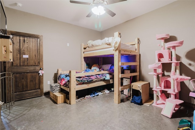 bedroom featuring concrete floors and a ceiling fan