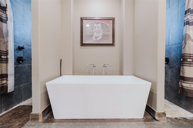 full bathroom featuring a soaking tub