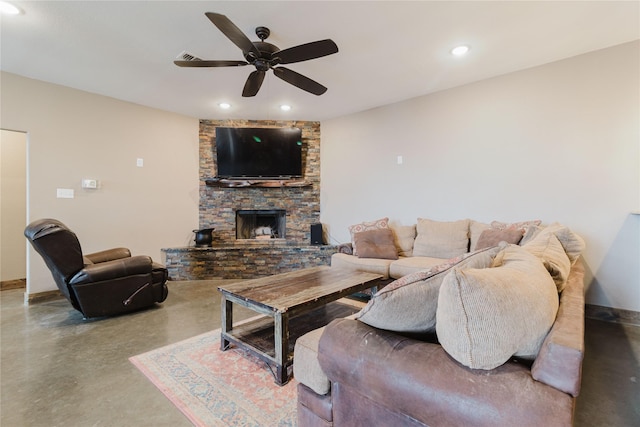 living room with a fireplace, recessed lighting, a ceiling fan, and concrete flooring