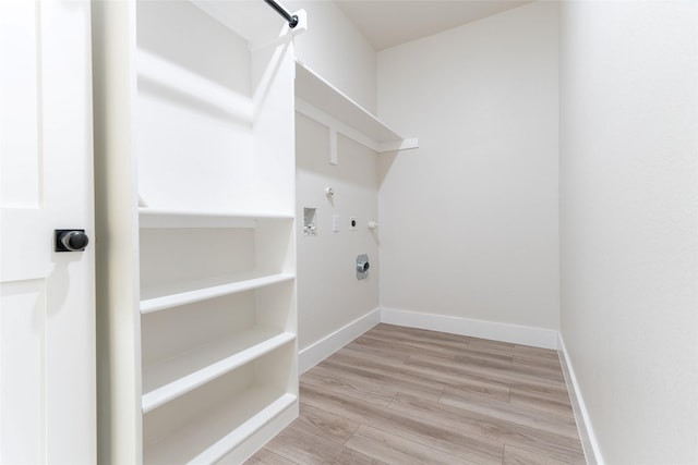 laundry area with gas dryer hookup, washer hookup, light hardwood / wood-style flooring, and electric dryer hookup