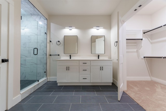 bathroom with vanity and a shower with shower door