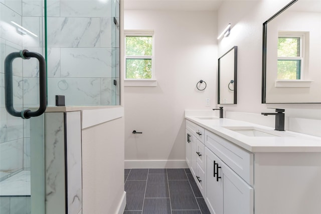 bathroom featuring vanity and a shower with door