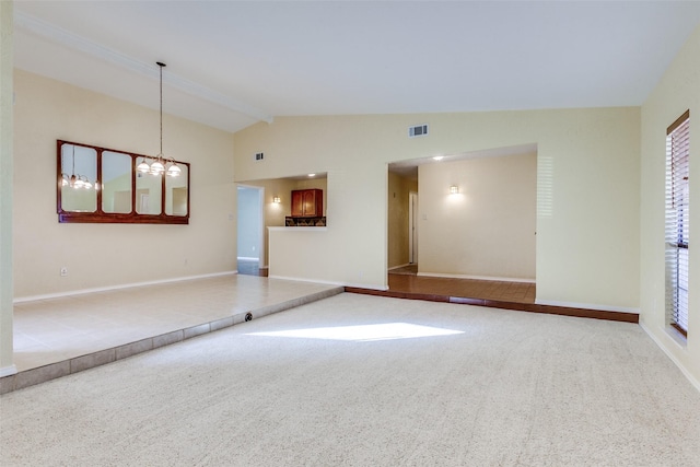 spare room featuring carpet, vaulted ceiling with beams, and a notable chandelier