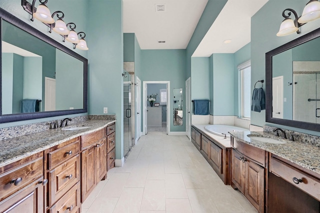 bathroom with vanity, shower with separate bathtub, tile patterned flooring, and plenty of natural light