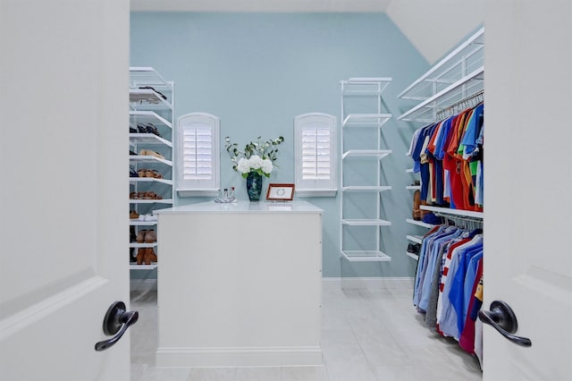 walk in closet featuring light tile patterned flooring