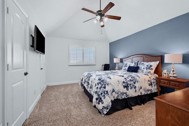 bedroom with light carpet, vaulted ceiling, and ceiling fan