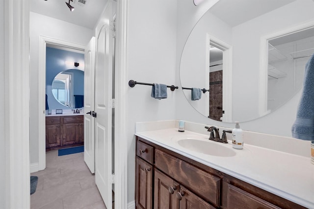 bathroom with vanity and tile patterned flooring