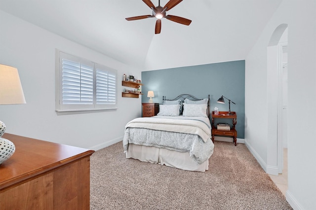 bedroom featuring ceiling fan, lofted ceiling, and light colored carpet