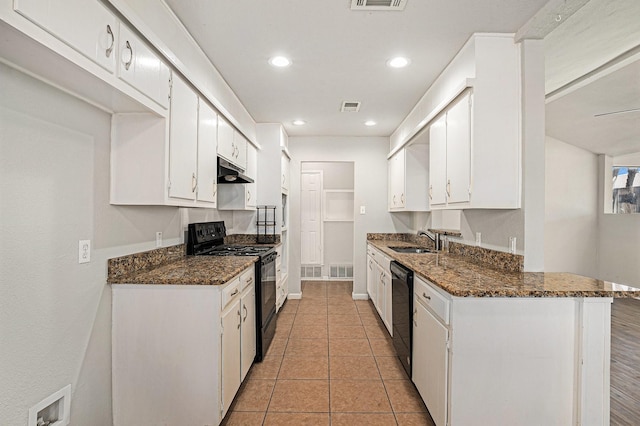 kitchen featuring white cabinetry, sink, dark stone counters, and black appliances