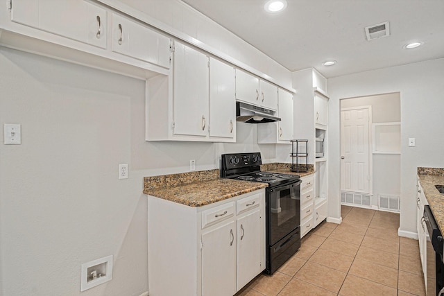 kitchen featuring white cabinetry, dark stone countertops, light tile patterned floors, and black appliances