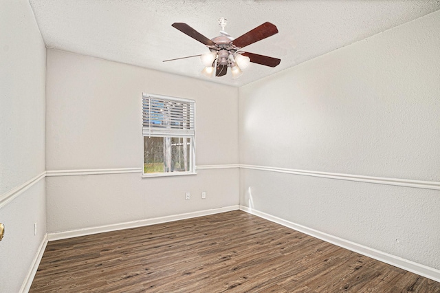 unfurnished room with a textured ceiling, dark hardwood / wood-style floors, and ceiling fan