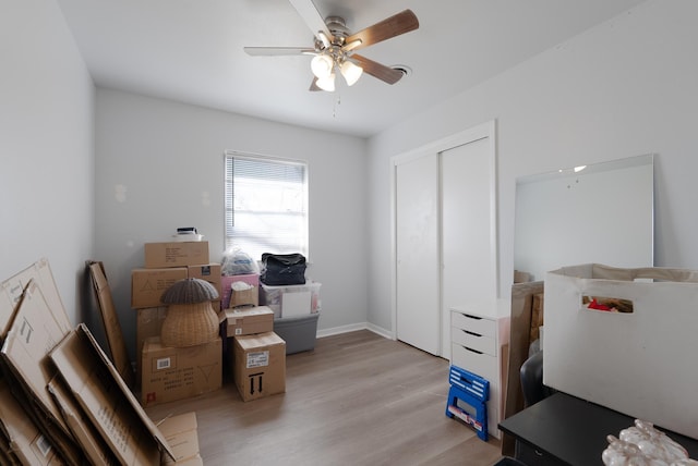 interior space with ceiling fan and light wood-type flooring