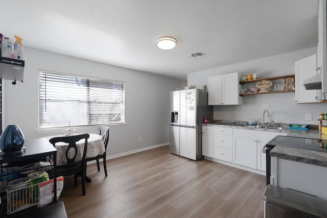 kitchen featuring sink, white cabinets, exhaust hood, stainless steel fridge with ice dispenser, and light hardwood / wood-style flooring