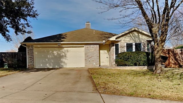 single story home featuring a garage and a front yard