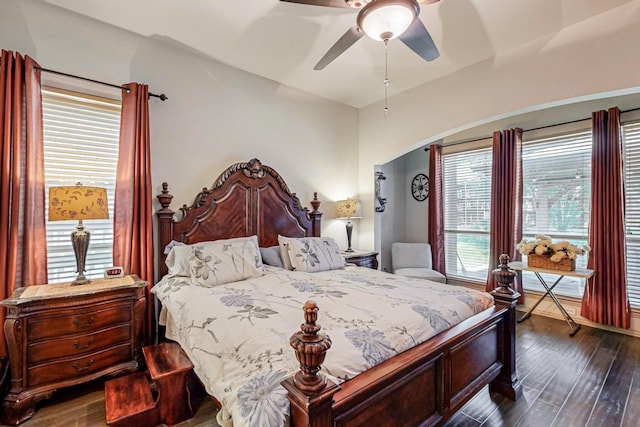 bedroom with ceiling fan and dark hardwood / wood-style flooring