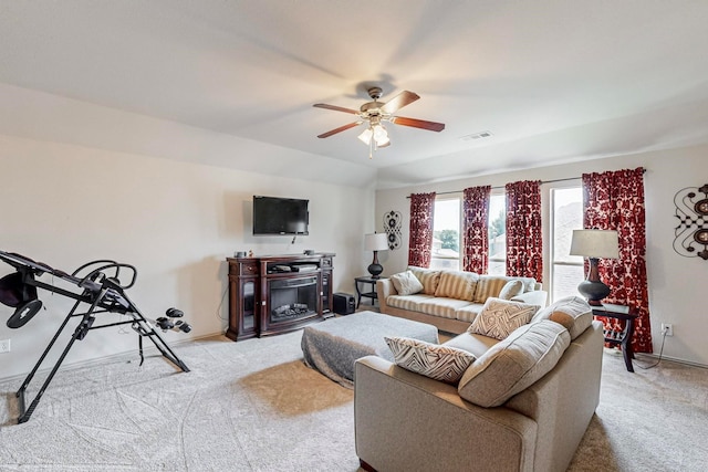 carpeted living room with ceiling fan