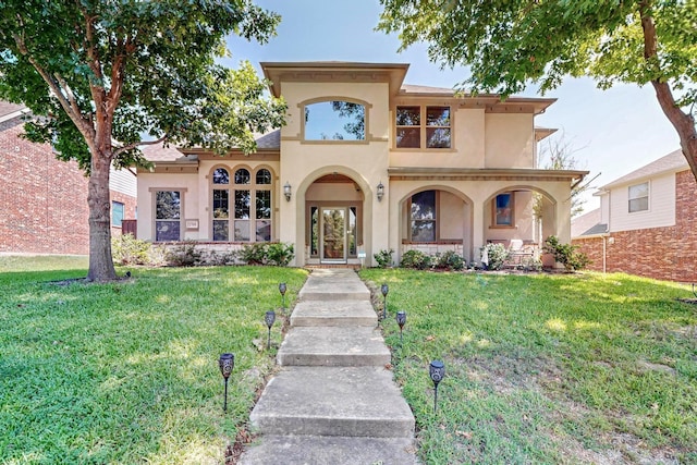 view of front of home with a front lawn