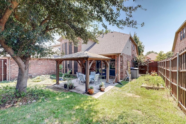 back of house featuring a gazebo, a yard, central AC, and a patio area