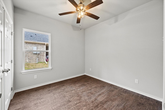 unfurnished room with dark hardwood / wood-style flooring and ceiling fan