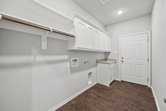 laundry area featuring cabinets, hookup for a washing machine, dark hardwood / wood-style floors, and hookup for an electric dryer